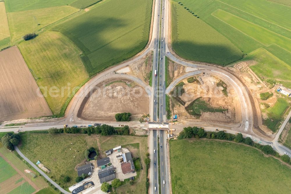 Emmerich am Rhein from above - Construction site for the new building of Routing and traffic lanes over the highway bridge in the motorway A 3 and einer neuen Autobahnauffahrt on Netterschdensche Strasse in Emmerich am Rhein in the state North Rhine-Westphalia, Germany