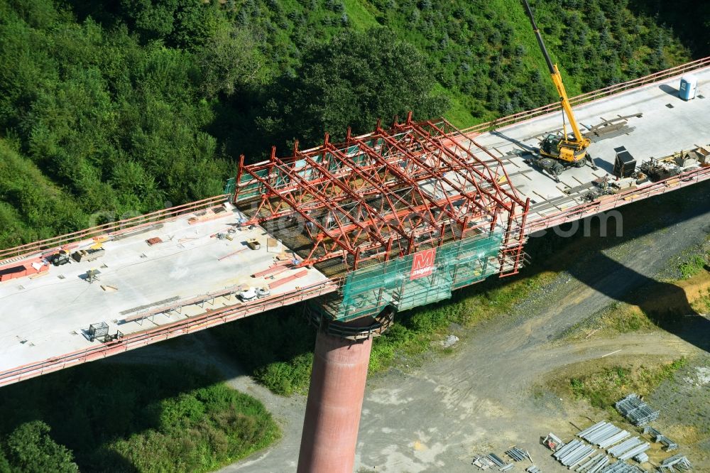 Olsberg from the bird's eye view: Construction site for the new building of Routing and traffic lanes over the highway bridge in the motorway A 46n in the district Bigge in Olsberg in the state North Rhine-Westphalia, Germany