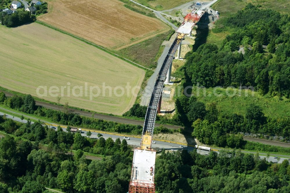 Olsberg from the bird's eye view: Construction site for the new building of Routing and traffic lanes over the highway bridge in the motorway A 46n in the district Bigge in Olsberg in the state North Rhine-Westphalia, Germany