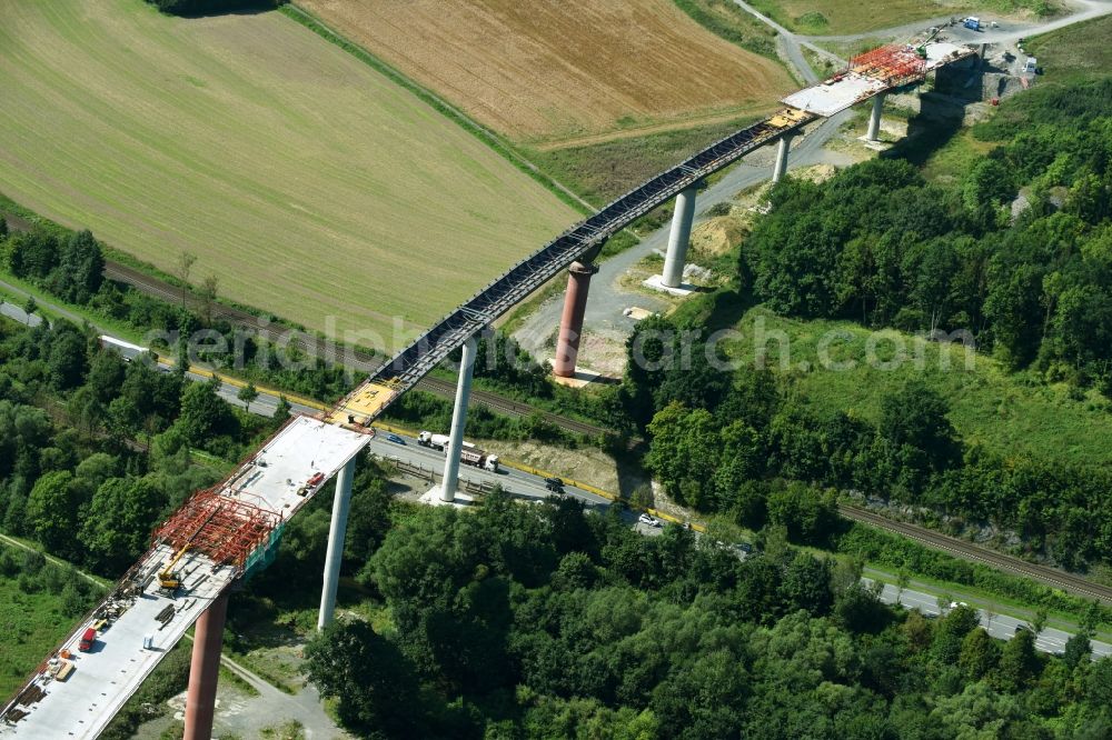 Olsberg from the bird's eye view: Construction site for the new building of Routing and traffic lanes over the highway bridge in the motorway A 46n in the district Bigge in Olsberg in the state North Rhine-Westphalia, Germany