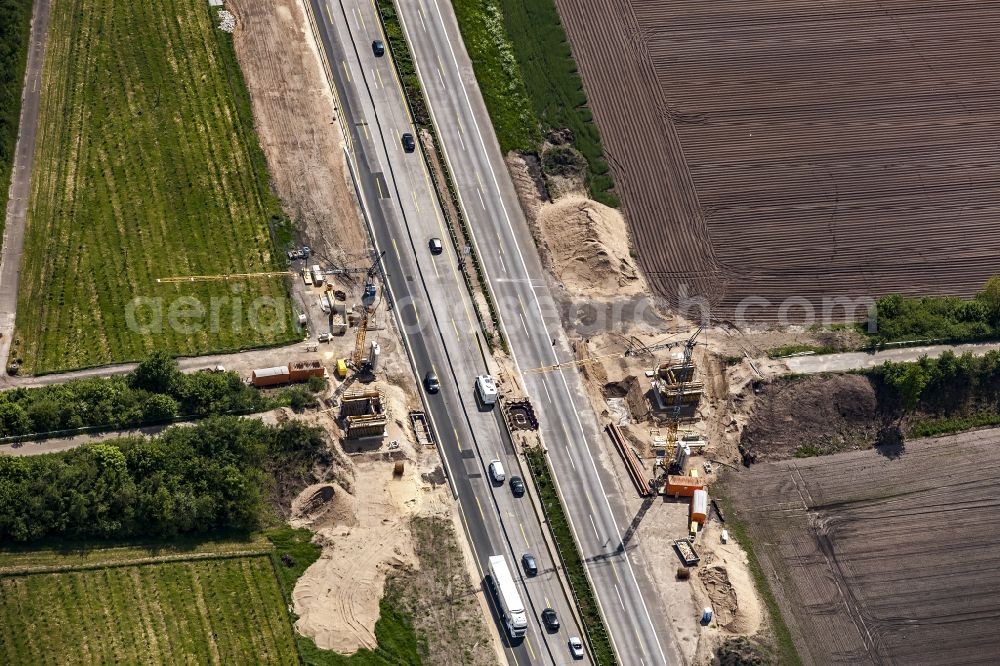 Padenstedt from above - Construction site for the new building of Routing and traffic lanes over the highway bridge in the motorway A 7 in Padenstedt in the state Schleswig-Holstein, Germany