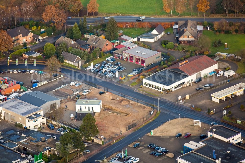 Voerde (Niederrhein) from above - Construction site at the car dealership of the car Autohaus Schnurbusch GmbH Grenzstrasse in the district Holthausen in Voerde (Niederrhein) in the state North Rhine-Westphalia