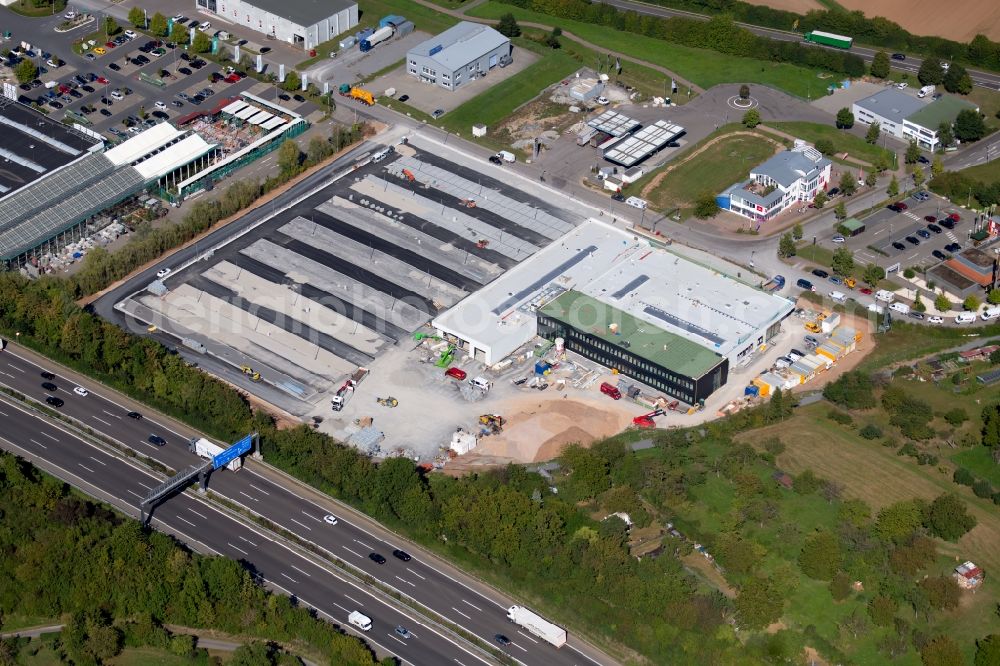 Ellhofen from above - Construction site at the car dealership of the car of Schwarz Mobility Solutions GmbH Am Autobahnkreuz in Ellhofen in the state Baden-Wurttemberg, Germany