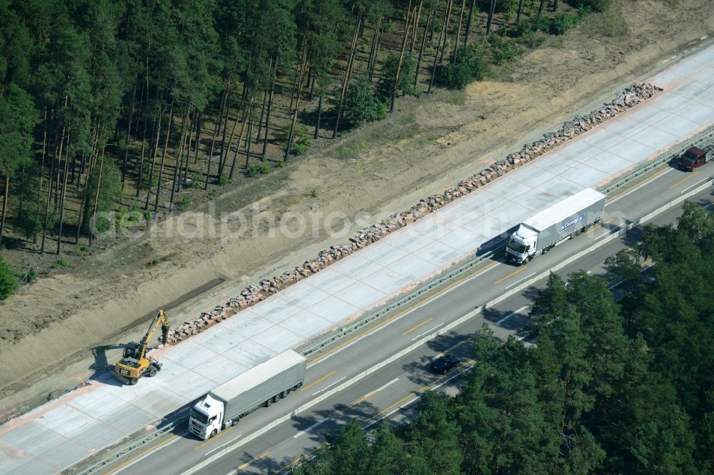 Spreenhagen from the bird's eye view: Highway construction site for the expansion and extension of track along the route of the motorway A12 E30 in Spreenhagen in the state Brandenburg