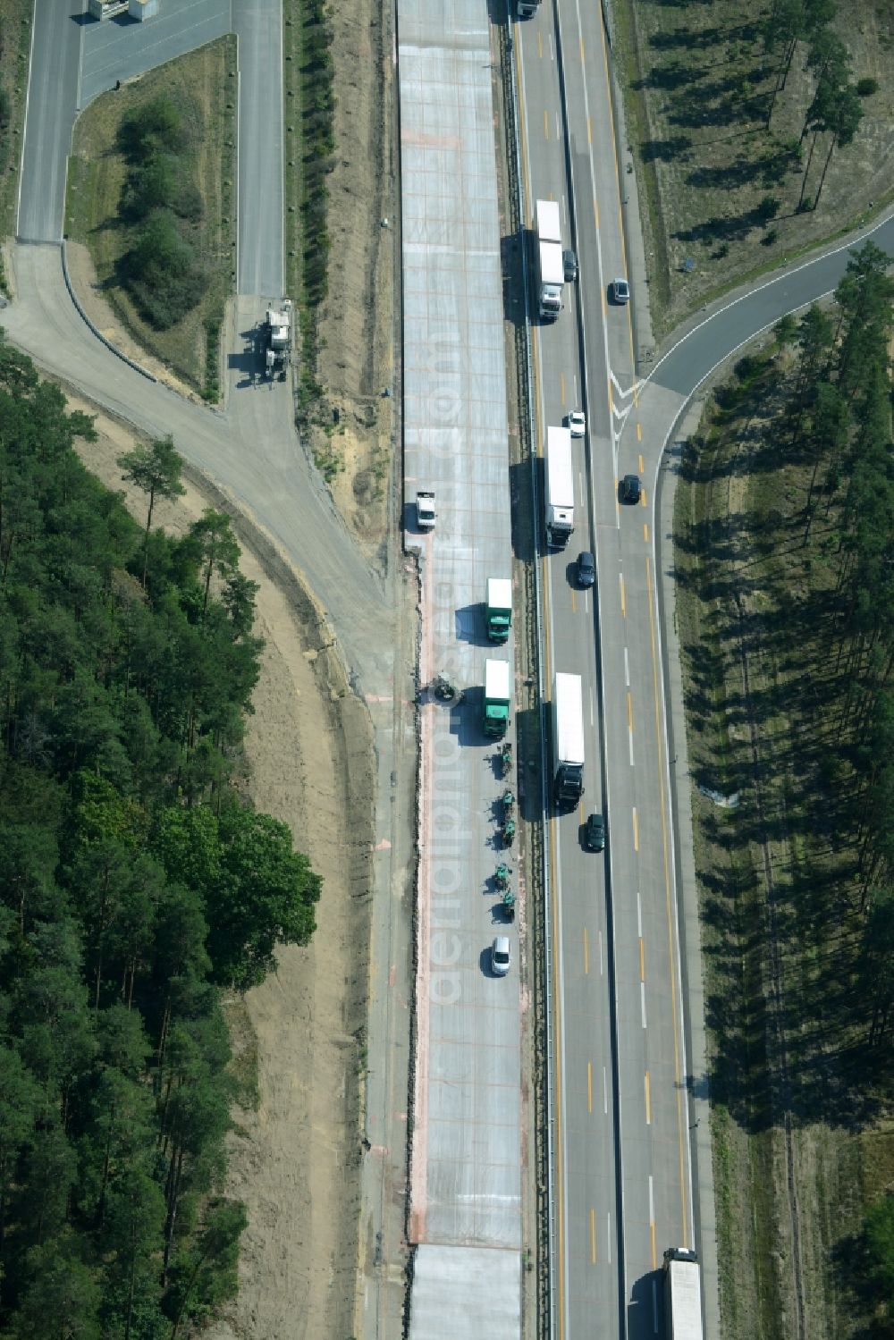 Spreenhagen from the bird's eye view: Highway construction site for the expansion and extension of track along the route of the motorway A12 E30 in Spreenhagen in the state Brandenburg