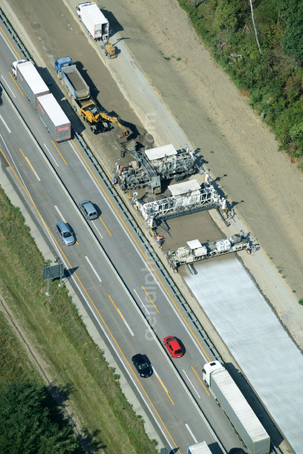 Aerial photograph Spreenhagen - Highway construction site for the expansion and extension of track along the route of motorway A12 E30 using a concrete paver of the company Eurovia Infra in Spreenhagen in the state Brandenburg