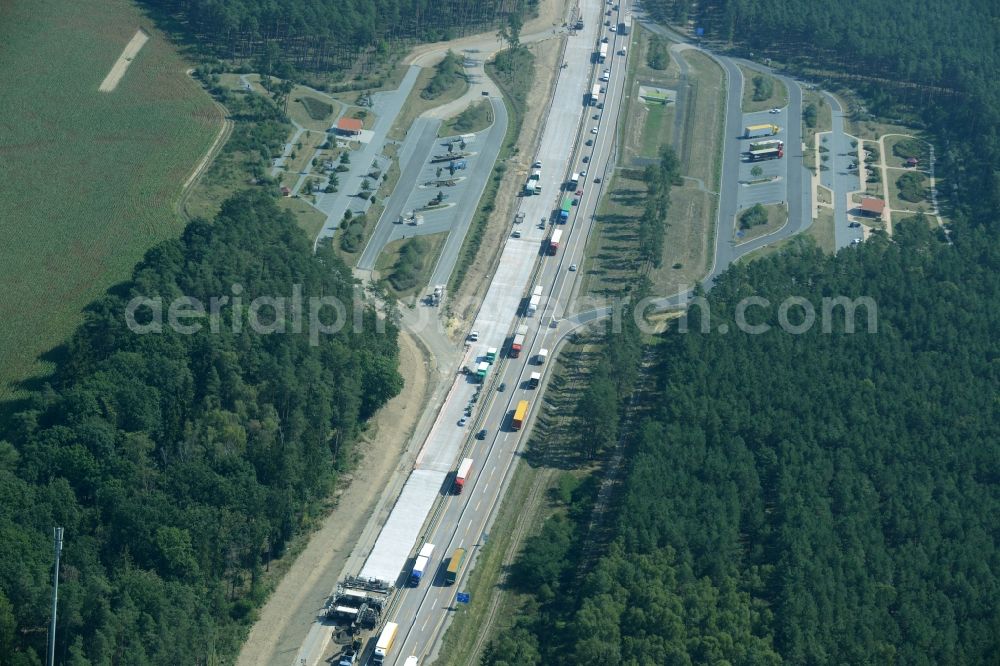 Aerial photograph Spreenhagen - Highway construction site for the expansion and extension of track along the route of motorway A12 E30 using a concrete paver of the company Eurovia Infra in Spreenhagen in the state Brandenburg