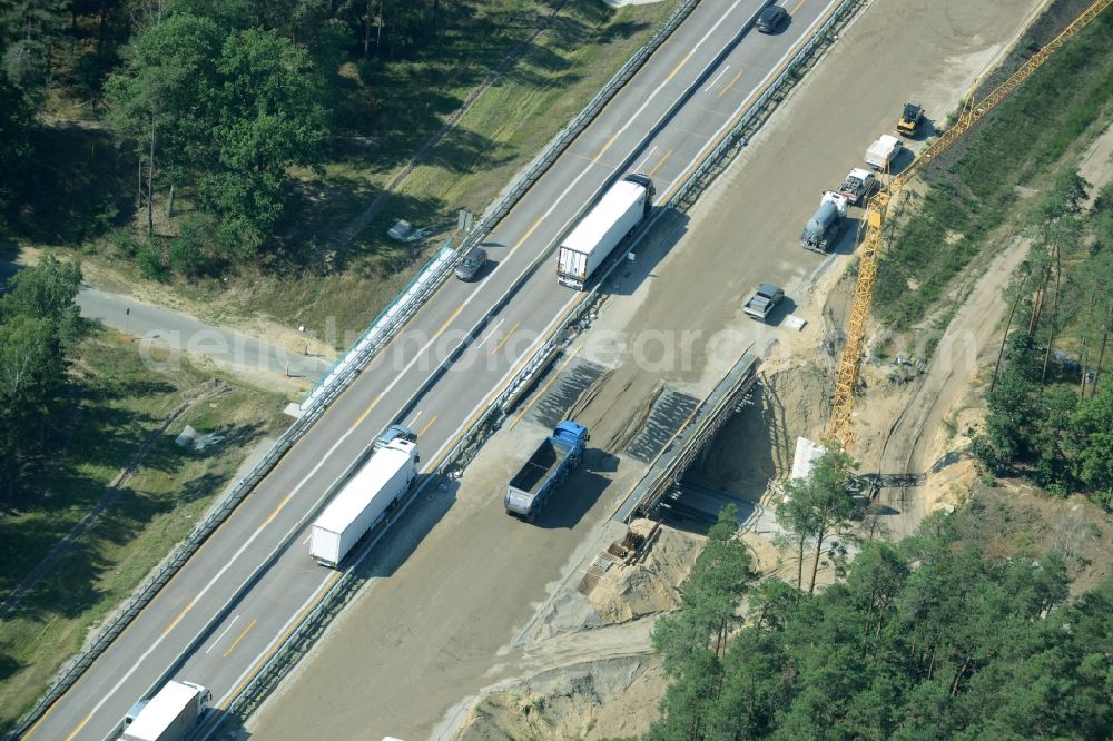 Spreenhagen from the bird's eye view: Highway construction site for the expansion and extension of track along the route of the motorway A12 E30 in Spreenhagen in the state Brandenburg