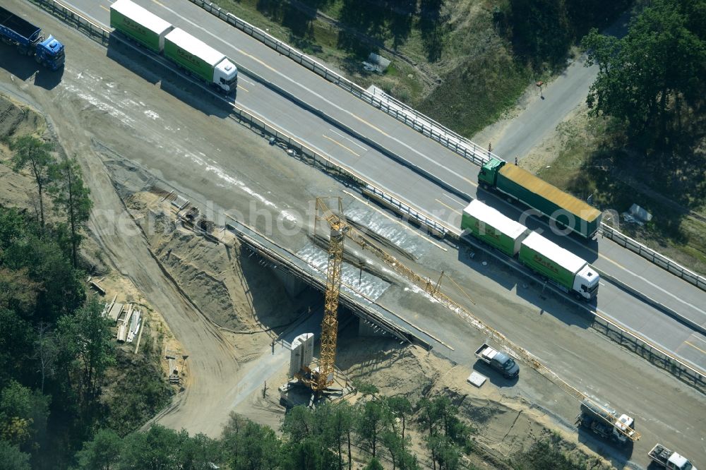 Spreenhagen from the bird's eye view: Highway construction site for the expansion and extension of track along the route of the motorway A12 E30 in Spreenhagen in the state Brandenburg