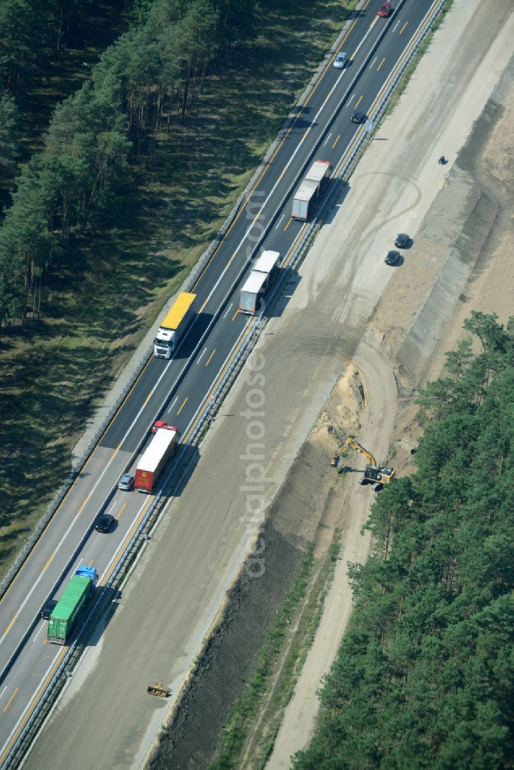 Spreenhagen from the bird's eye view: Highway construction site for the expansion and extension of track along the route of the motorway A12 E30 in Spreenhagen in the state Brandenburg