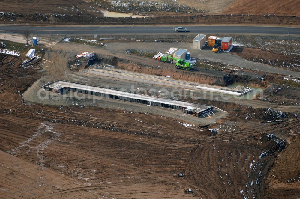 Aerial image Eisenach - Neubautrasse der BAB A 4 - Umfahrung Hörselberge in Thüringen bei Eisenach. Im September 2007 hat das Bieterkonsortium VINCI Concessions / Hochtief PPP (50/50) den Zuschlag für das A-Modell BAB A 4 Umfahrung Hörselberge (km 238,5 bis km 283,2) erhalten. Die bei diesem Projekt auf der Bauausführungsebene gegründete Arbeitsgemeinschaft wird von der EUROVIA Infra GmbH angeführt, des Weiteren sind hier die Unternehmen Hochtief, Strassing Limes und Rädlinger beteiligt. Durchgeführt werden die im Zuge dieses Projektes notwendigen Arbeiten unter an derem von den Mitarbeitern der Niederlassung Weimar der EUROVIA Verkehrsbau Union sowie der Niederlassungen Abbruch und Erdbau, Betonstraßenbau, Ingenieurbau und TECO Schallschutz der EUROVIA Beton.