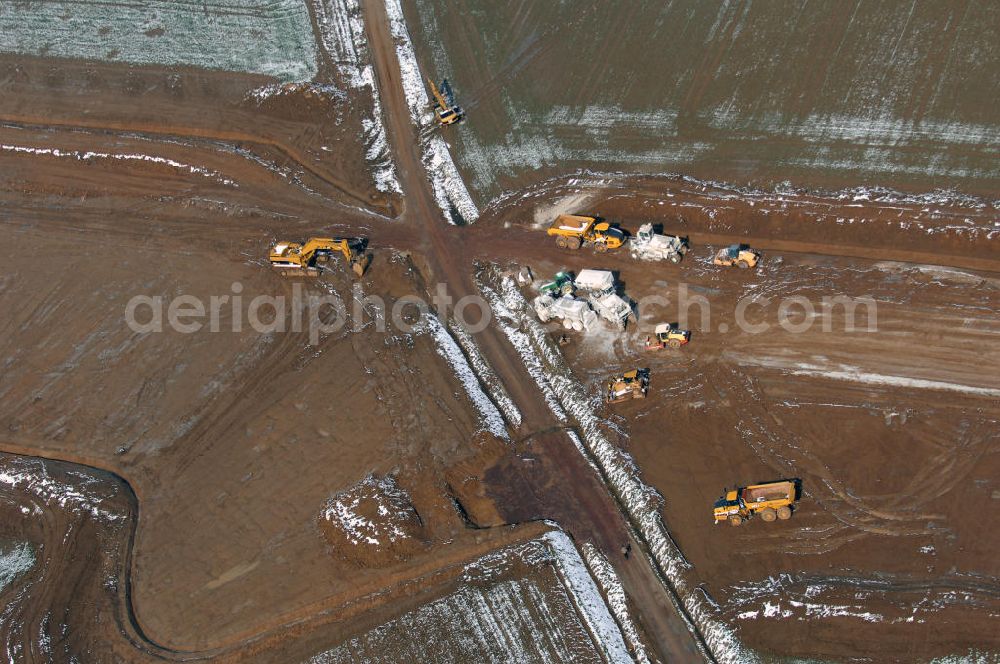 Aerial photograph Eisenach - Neubautrasse der BAB A 4 - Umfahrung Hörselberge in Thüringen bei Eisenach. Im September 2007 hat das Bieterkonsortium VINCI Concessions / Hochtief PPP (50/50) den Zuschlag für das A-Modell BAB A 4 Umfahrung Hörselberge (km 238,5 bis km 283,2) erhalten. Die bei diesem Projekt auf der Bauausführungsebene gegründete Arbeitsgemeinschaft wird von der EUROVIA Infra GmbH angeführt, des Weiteren sind hier die Unternehmen Hochtief, Strassing Limes und Rädlinger beteiligt. Durchgeführt werden die im Zuge dieses Projektes notwendigen Arbeiten unter an derem von den Mitarbeitern der Niederlassung Weimar der EUROVIA Verkehrsbau Union sowie der Niederlassungen Abbruch und Erdbau, Betonstraßenbau, Ingenieurbau und TECO Schallschutz der EUROVIA Beton.