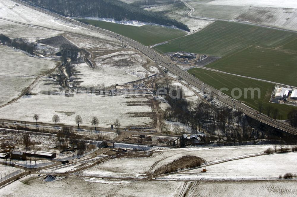 Aerial photograph Eisenach - Neubautrasse der BAB A 4 - Umfahrung Hörselberge in Thüringen bei Eisenach. Im September 2007 hat das Bieterkonsortium VINCI Concessions / Hochtief PPP (50/50) den Zuschlag für das A-Modell BAB A 4 Umfahrung Hörselberge (km 238,5 bis km 283,2) erhalten. Die bei diesem Projekt auf der Bauausführungsebene gegründete Arbeitsgemeinschaft wird von der EUROVIA Infra GmbH angeführt, des Weiteren sind hier die Unternehmen Hochtief, Strassing Limes und Rädlinger beteiligt. Durchgeführt werden die im Zuge dieses Projektes notwendigen Arbeiten unter an derem von den Mitarbeitern der Niederlassung Weimar der EUROVIA Verkehrsbau Union sowie der Niederlassungen Abbruch und Erdbau, Betonstraßenbau, Ingenieurbau und TECO Schallschutz der EUROVIA Beton.