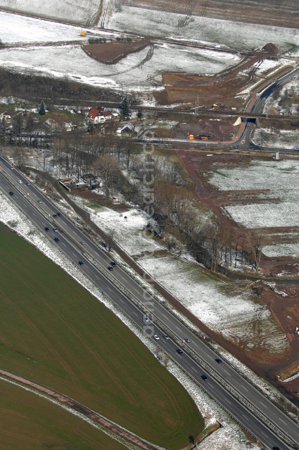 Aerial image Eisenach - Neubautrasse der BAB A 4 - Umfahrung Hörselberge in Thüringen bei Eisenach. Im September 2007 hat das Bieterkonsortium VINCI Concessions / Hochtief PPP (50/50) den Zuschlag für das A-Modell BAB A 4 Umfahrung Hörselberge (km 238,5 bis km 283,2) erhalten. Die bei diesem Projekt auf der Bauausführungsebene gegründete Arbeitsgemeinschaft wird von der EUROVIA Infra GmbH angeführt, des Weiteren sind hier die Unternehmen Hochtief, Strassing Limes und Rädlinger beteiligt. Durchgeführt werden die im Zuge dieses Projektes notwendigen Arbeiten unter an derem von den Mitarbeitern der Niederlassung Weimar der EUROVIA Verkehrsbau Union sowie der Niederlassungen Abbruch und Erdbau, Betonstraßenbau, Ingenieurbau und TECO Schallschutz der EUROVIA Beton.