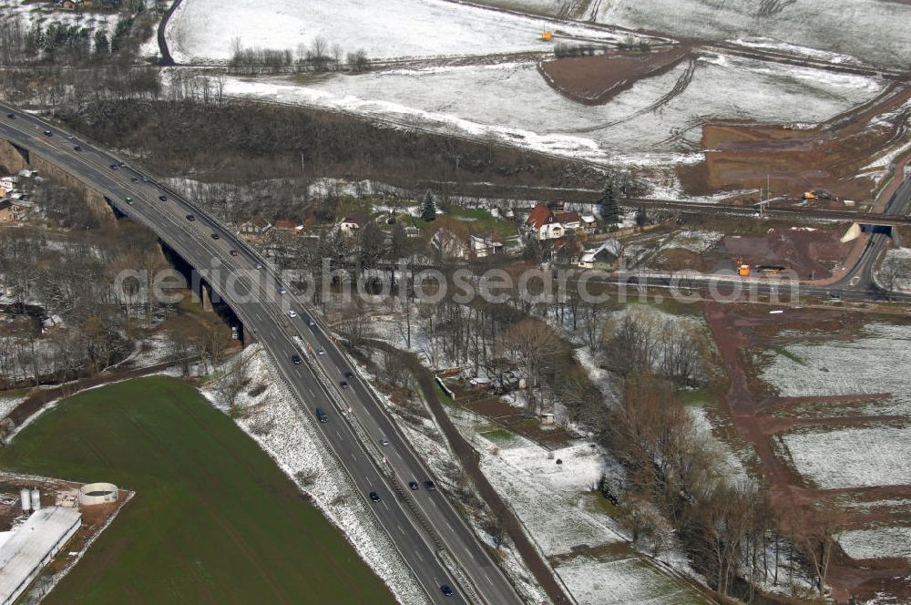 Aerial photograph Eisenach - Neubautrasse der BAB A 4 - Umfahrung Hörselberge in Thüringen bei Eisenach. Im September 2007 hat das Bieterkonsortium VINCI Concessions / Hochtief PPP (50/50) den Zuschlag für das A-Modell BAB A 4 Umfahrung Hörselberge (km 238,5 bis km 283,2) erhalten. Die bei diesem Projekt auf der Bauausführungsebene gegründete Arbeitsgemeinschaft wird von der EUROVIA Infra GmbH angeführt, des Weiteren sind hier die Unternehmen Hochtief, Strassing Limes und Rädlinger beteiligt. Durchgeführt werden die im Zuge dieses Projektes notwendigen Arbeiten unter an derem von den Mitarbeitern der Niederlassung Weimar der EUROVIA Verkehrsbau Union sowie der Niederlassungen Abbruch und Erdbau, Betonstraßenbau, Ingenieurbau und TECO Schallschutz der EUROVIA Beton.