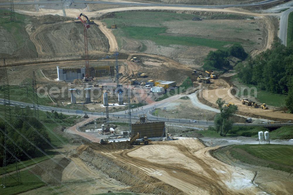 Aerial image Eisenach - Kindel - Neubautrasse der BAB A 4 - Umfahrung Hörselberge in Thüringen bei Eisenach. Im September 2007 hat das Bieterkonsortium VINCI Concessions / Hochtief PPP (50/50) den Zuschlag für das A-Modell BAB A 4 Umfahrung Hörselberge (km 238,5 bis km 283,2) erhalten. Die bei diesem Projekt auf der Bauausführungsebene gegründete Arbeitsgemeinschaft wird von der EUROVIA Infra GmbH angeführt, des Weiteren sind hier die Unternehmen Hochtief, Strassing Limes und Rädlinger beteiligt. Durchgeführt werden die im Zuge dieses Projektes notwendigen Arbeiten unter an derem von den Mitarbeitern der Niederlassung Weimar der EUROVIA Verkehrsbau Union sowie der Niederlassungen Abbruch und Erdbau, Betonstraßenbau, Ingenieurbau und TECO Schallschutz der EUROVIA Beton. DEGES