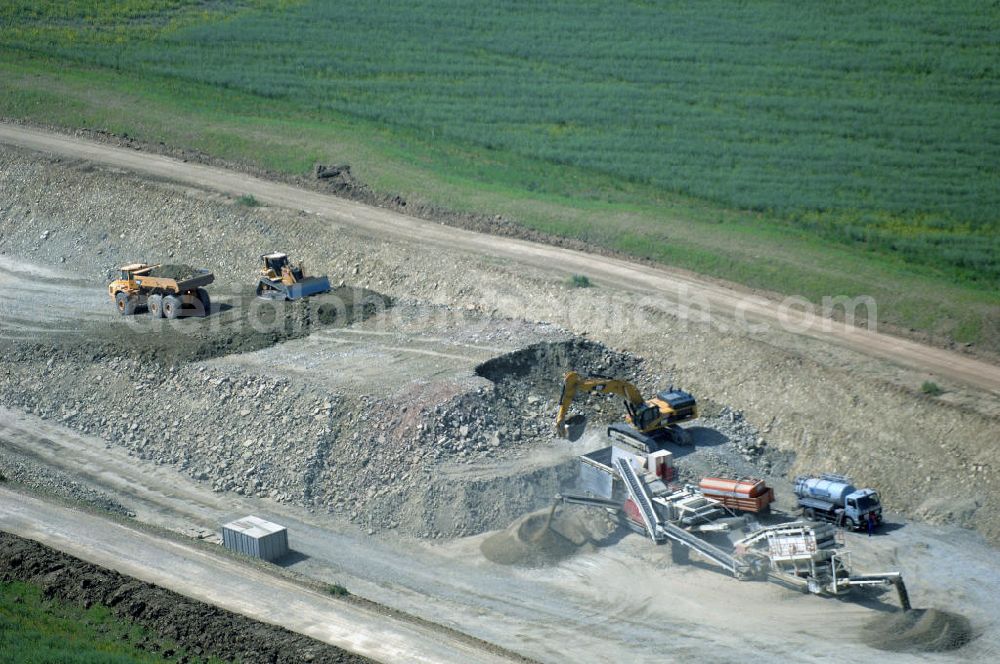 Eisenach - Kindel from the bird's eye view: Neubautrasse der BAB A 4 - Umfahrung Hörselberge in Thüringen bei Eisenach. Im September 2007 hat das Bieterkonsortium VINCI Concessions / Hochtief PPP (50/50) den Zuschlag für das A-Modell BAB A 4 Umfahrung Hörselberge (km 238,5 bis km 283,2) erhalten. Die bei diesem Projekt auf der Bauausführungsebene gegründete Arbeitsgemeinschaft wird von der EUROVIA Infra GmbH angeführt, des Weiteren sind hier die Unternehmen Hochtief, Strassing Limes und Rädlinger beteiligt. Durchgeführt werden die im Zuge dieses Projektes notwendigen Arbeiten unter an derem von den Mitarbeitern der Niederlassung Weimar der EUROVIA Verkehrsbau Union sowie der Niederlassungen Abbruch und Erdbau, Betonstraßenbau, Ingenieurbau und TECO Schallschutz der EUROVIA Beton. DEGES