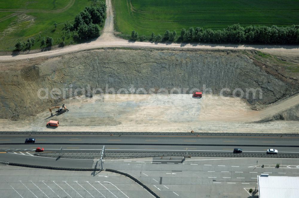 Eisenach - Kindel from the bird's eye view: Neubautrasse der BAB A 4 - Umfahrung Hörselberge in Thüringen bei Eisenach. Im September 2007 hat das Bieterkonsortium VINCI Concessions / Hochtief PPP (50/50) den Zuschlag für das A-Modell BAB A 4 Umfahrung Hörselberge (km 238,5 bis km 283,2) erhalten. Die bei diesem Projekt auf der Bauausführungsebene gegründete Arbeitsgemeinschaft wird von der EUROVIA Infra GmbH angeführt, des Weiteren sind hier die Unternehmen Hochtief, Strassing Limes und Rädlinger beteiligt. Durchgeführt werden die im Zuge dieses Projektes notwendigen Arbeiten unter an derem von den Mitarbeitern der Niederlassung Weimar der EUROVIA Verkehrsbau Union sowie der Niederlassungen Abbruch und Erdbau, Betonstraßenbau, Ingenieurbau und TECO Schallschutz der EUROVIA Beton. DEGES