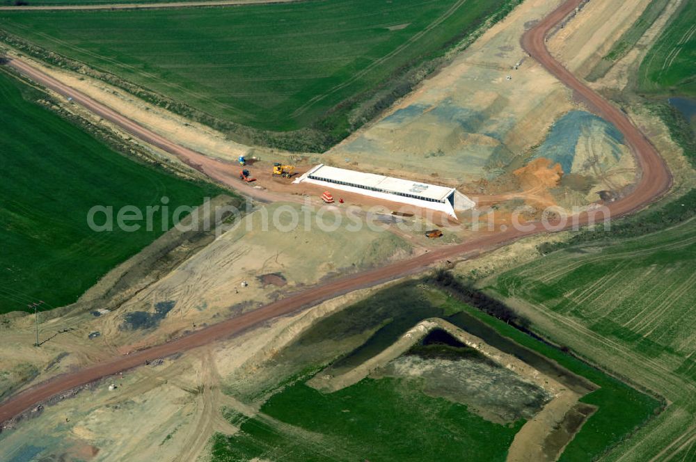 Aerial photograph Hastrungsfeld - Blick auf die Baustelle der A4 mit einer Unterführung bei Hastrungsfeld. Der Neubau ist Teil des Projekt Nordverlegung / Umfahrung Hörselberge der Autobahn E40 / A4 in Thüringen bei Eisenach. Durchgeführt werden die im Zuge dieses Projektes notwendigen Arbeiten unter an derem von den Mitarbeitern der Niederlassung Weimar der EUROVIA Verkehrsbau Union sowie der Niederlassungen Abbruch und Erdbau, Betonstraßenbau, Ingenieurbau und TECO Schallschutz der EUROVIA Beton sowie der DEGES.