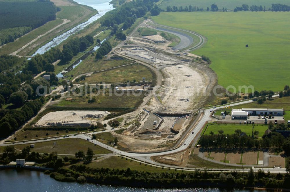 Aerial image Großkoschen - Blick auf die Baustelle eines Überleiters vom Senftenberger See zum Geierswalder See. Das Lausitzer Seenland mit seinen zehn Bergbaufolgeseen soll mit 13 Überleitern in ein schiffbares mit allen Seen verbundenes Seengebiet zusammengeführt werden. Beim Projekt Überleiter 12 erfolgt die Verbindung zwischen den beiden Seen mittels zweier Tunnel / Unterquerung zum einen der Bundesstraße B 96 und zum an deren des noch zu verlegendem Wasserlaufs der Schwarzen Elster. Am Oberen Vorhafen erfolgt der Bau einer Schleuse / Schlausenanlage. Kontakt: Lausitzer und Mitteldeutsche Bergbau-Verwaltungsgesellschaft mbH, LMBV, Abteilung Liegenschaften Lausitz, Dr. Bernd Krüger, Abteilungsleiter, Tel. +49(0)3573 844-210, Fax +49(0)3573 844-602, bernd.krueger@lmbv.de; Kontakt Bauausführung: Strabag AG Direktion Straßenbau Berlin-Brandenburg, Bereich Lausitz, Güterbahnhofstraße o. Nr., 01968 Senftenberg, Tel. +49(0)3573 3723-0, Fax +49(0)3573 3723-40, ber-sb-lausitz@strabag.com