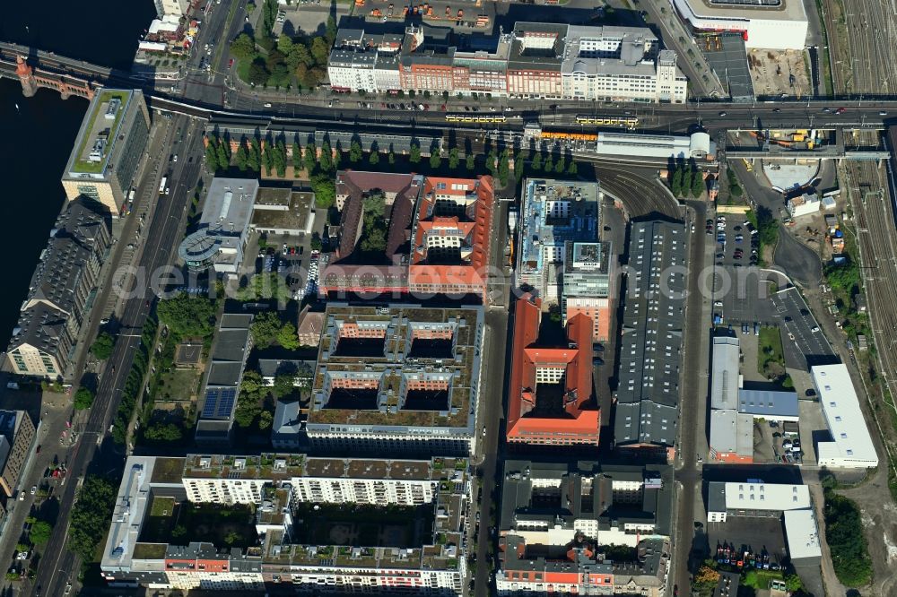 Aerial image Berlin - Construction site on building of the monument protected former Osram respectively Narva company premises Oberbaum City in the district Friedrichshain in Berlin. Here, among many other companies, BASF Services Europe, the German Post Customer Service Center GmbH and Heineken Germany GmbH are located. It is owned by HVB Immobilien AG, which is part of the UniCredit Group