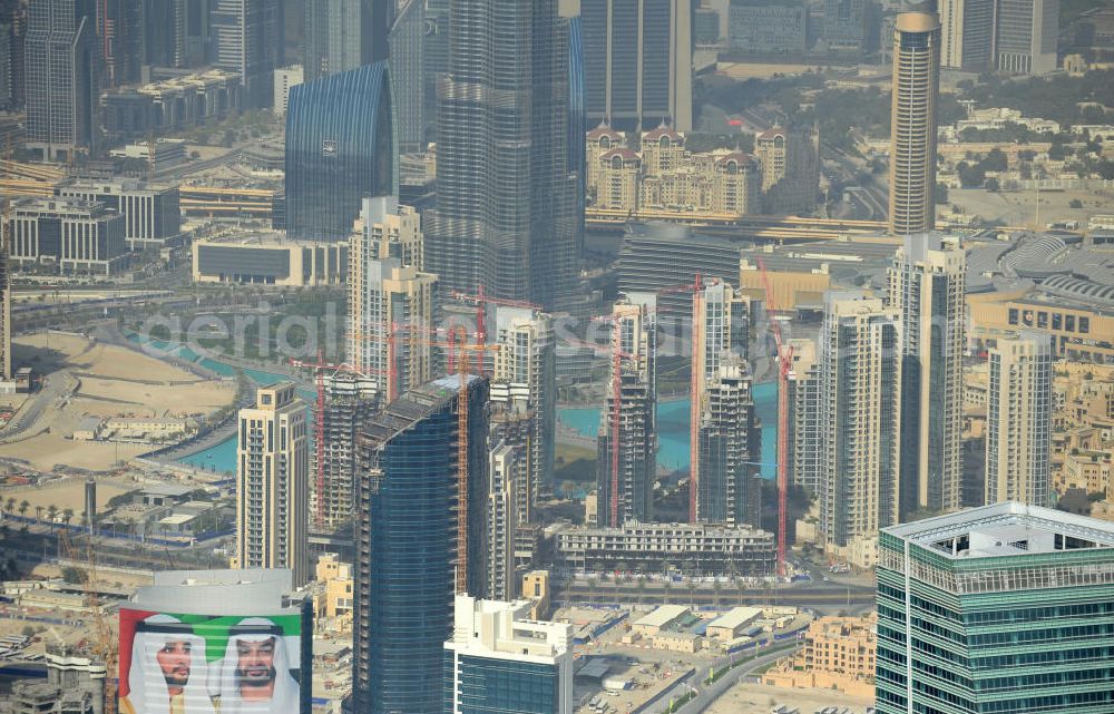 Dubai from the bird's eye view: The Burj Residences ( in the center ) is part of the urban development project Business Bay. Burj Residence is a stockbroking firm which is specialized in Downtown Burj Dubai and has built apartments there. In the right-hand corner is the top of the Ubora Towers