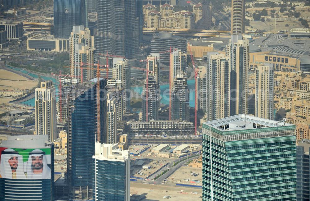 Aerial image Dubai - The Burj Residences ( in the center ) is part of the urban development project Business Bay. Burj Residence is a stockbroking firm which is specialized in Downtown Burj Dubai and has built apartments there. In the right-hand corner is the top of the Ubora Towers