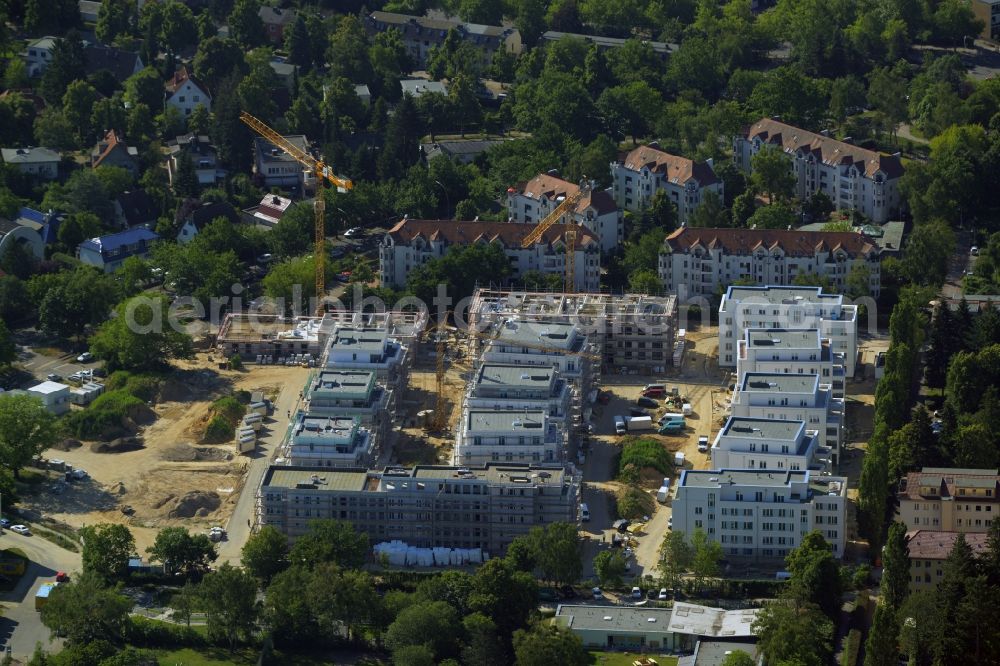 Aerial image Berlin - View of the building lot of a residential quarter of Cedelia construction project in Berlin-Zehlendorf at Dahlemer Weg and the Robert-W-Kempner-Strasse. The project is a joint venture of the project partners HKP Dahlemer Weg Verwaltungs GmbH, HOCHTIEF-HTP Projektentwicklung and KONDOR WESSELS