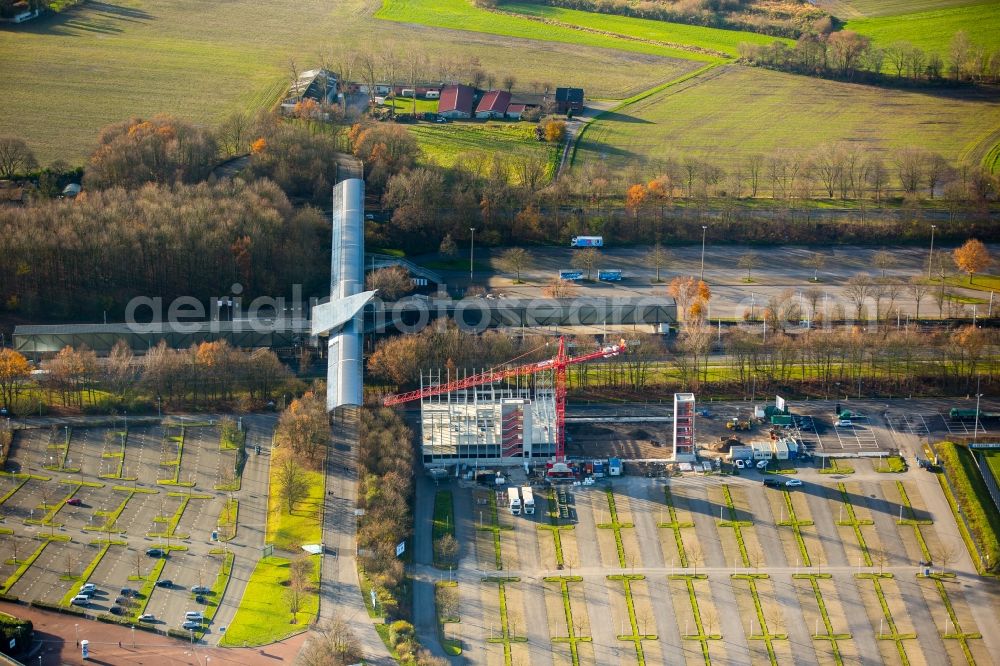 Aerial photograph Gelsenkirchen - Football stadium Veltins Arena Auf Schalke of the football club Schalke 04 in Gelsenkirchen in the state of North Rhine-Westphalia. A new park house is being built behind the stadium