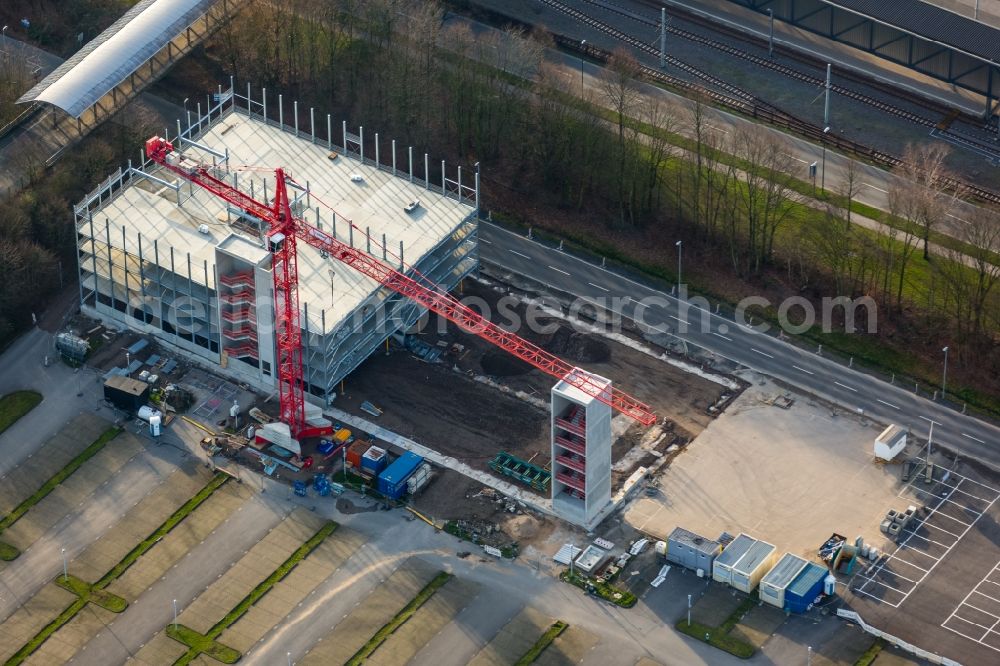 Aerial image Gelsenkirchen - Construction site of a new parking facility at the Football stadium Veltins Arena Auf Schalke of the football club Schalke 04 in Gelsenkirchen in the state of North Rhine-Westphalia. A new park house is being built behind the stadium