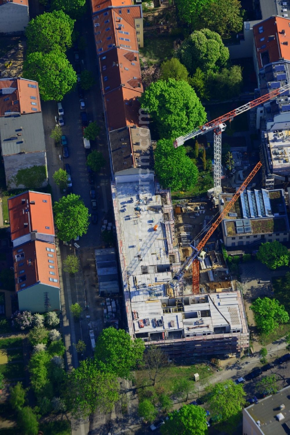 Aerial photograph Berlin - Construction site of a residential building in the Rummelsburg part of the district of Lichtenberg in Berlin in Germany. The construction site is located on Kernhofer Strasse, on the corner of Tuerrschmidtstrasse. A multi-family house with commercial units is planned as well as a hotel