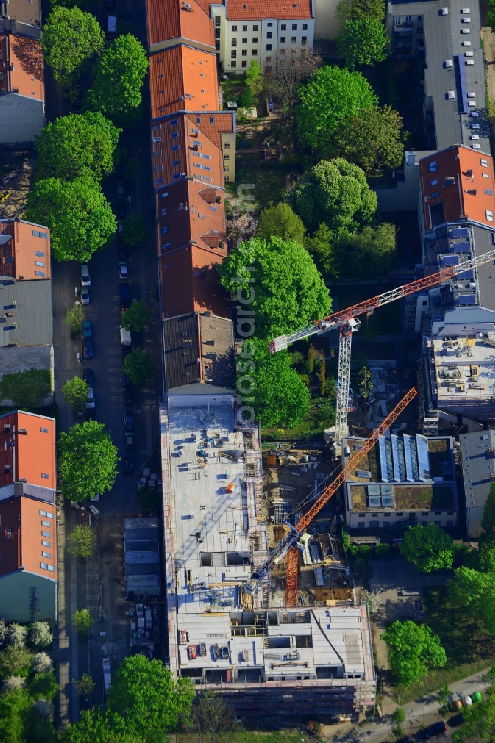 Berlin from above - Construction site of a residential building in the Rummelsburg part of the district of Lichtenberg in Berlin in Germany. The construction site is located on Kernhofer Strasse, on the corner of Tuerrschmidtstrasse. A multi-family house with commercial units is planned as well as a hotel