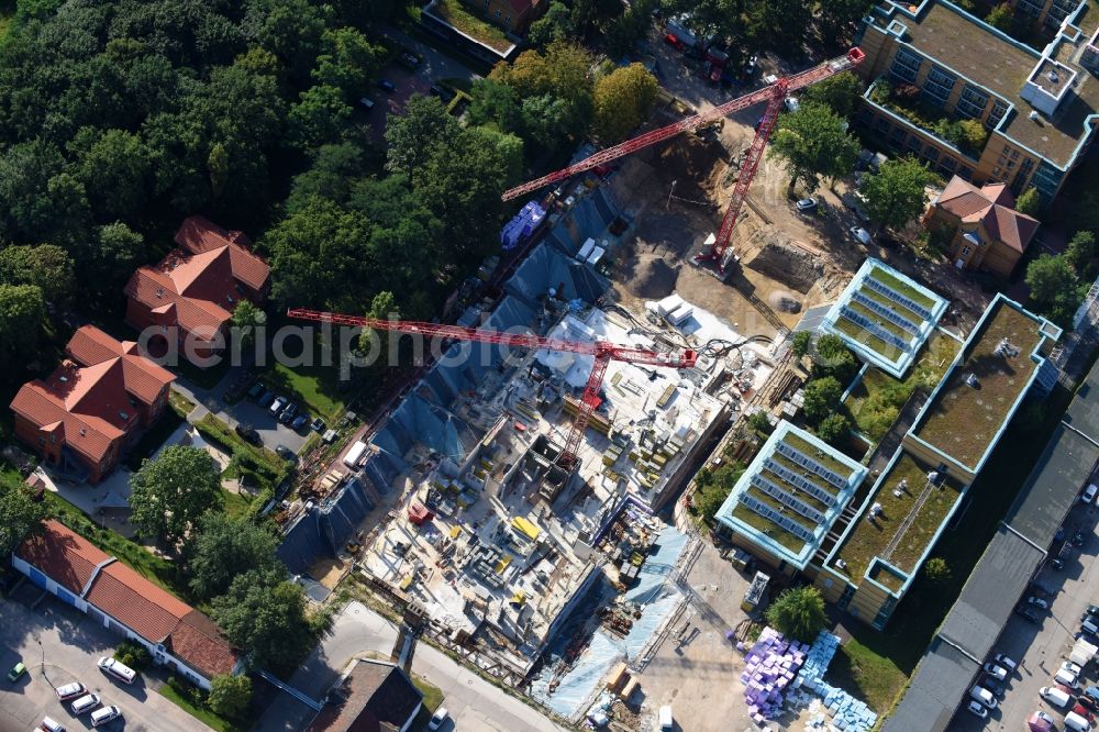 Berlin from the bird's eye view: Construction site for a new extension to the hospital grounds Arona Klinik of UKB BG Klinikum Unfallkrankenhaus Berlin gGmbH in the district Bezirk Marzahn-Hellersdorf in Berlin