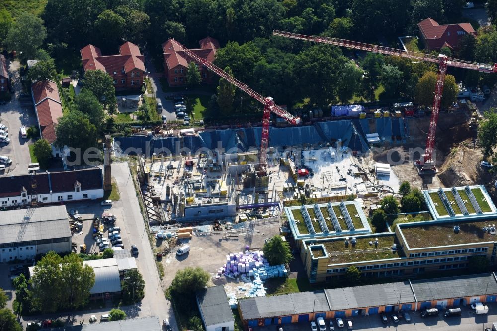 Berlin from above - Construction site for a new extension to the hospital grounds Arona Klinik of UKB BG Klinikum Unfallkrankenhaus Berlin gGmbH in the district Bezirk Marzahn-Hellersdorf in Berlin