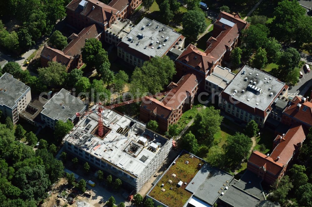 Berlin from above - Construction site for a new extension to the hospital grounds Evangelisches Krankenhaus Koenigin Elisabeth Herzberge GmbH on Herzbergstrasse in the district Lichtenberg in Berlin, Germany