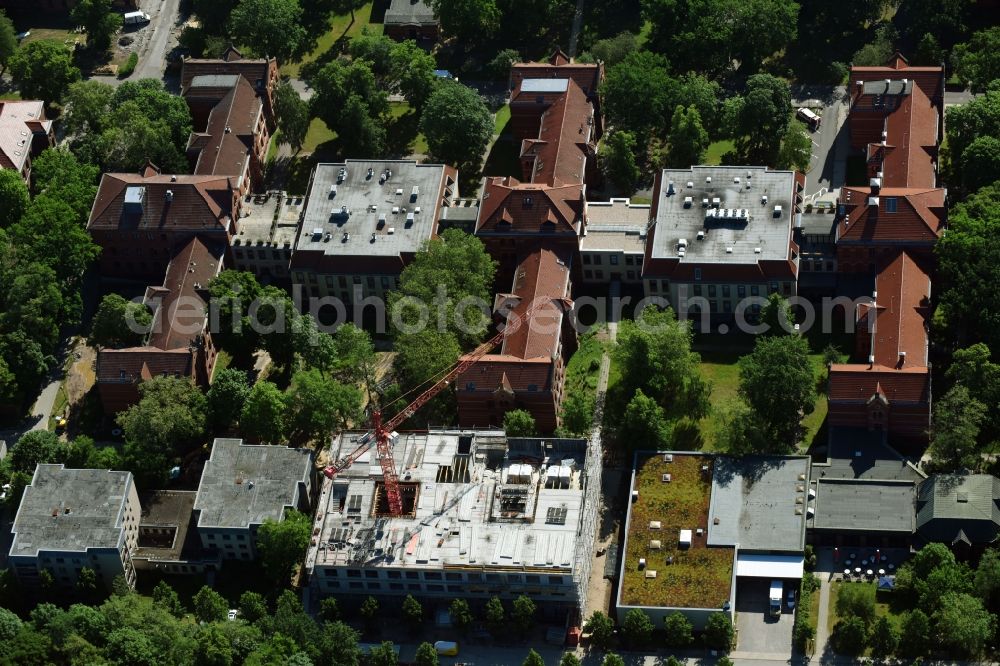 Aerial image Berlin - Construction site for a new extension to the hospital grounds Evangelisches Krankenhaus Koenigin Elisabeth Herzberge GmbH on Herzbergstrasse in the district Lichtenberg in Berlin, Germany