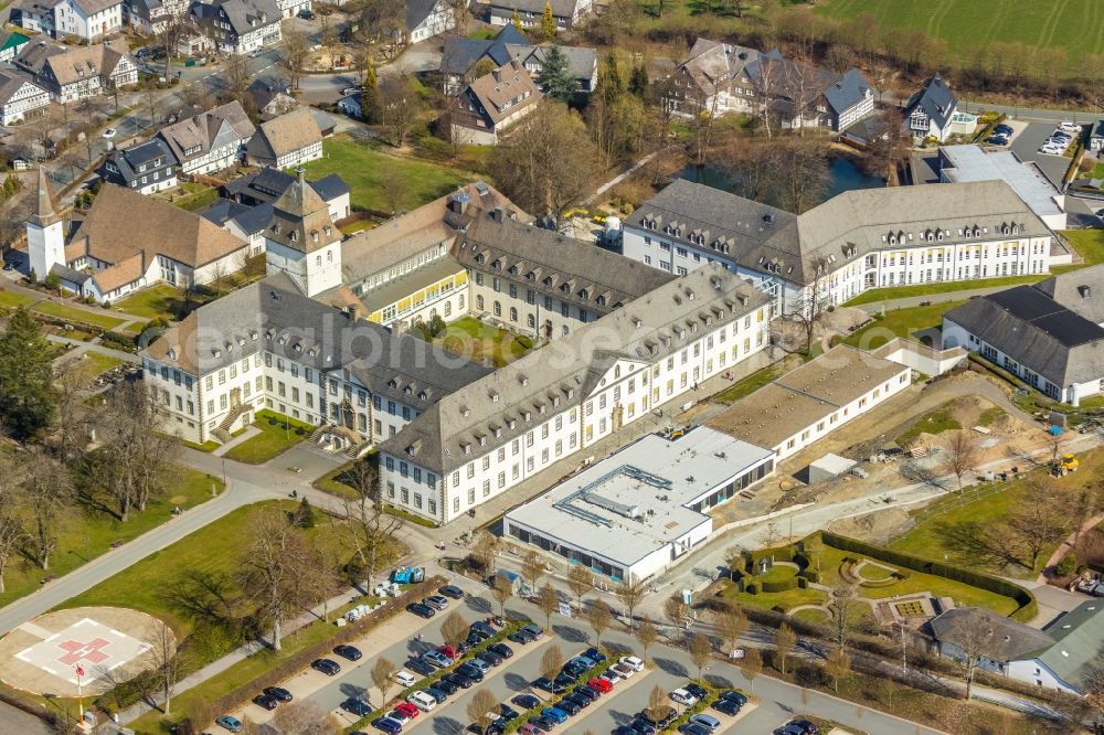 Schmallenberg from the bird's eye view: Construction site for a new extension to the hospital grounds Fachkronkenhaus Kloster Grafschaft on Annostrasse in Schmallenberg in the state North Rhine-Westphalia, Germany