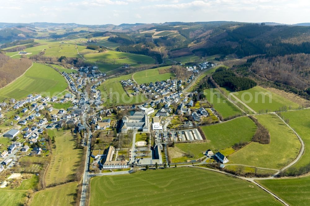 Schmallenberg from the bird's eye view: Construction site for a new extension to the hospital grounds Fachkronkenhaus Kloster Grafschaft on Annostrasse in Schmallenberg in the state North Rhine-Westphalia, Germany