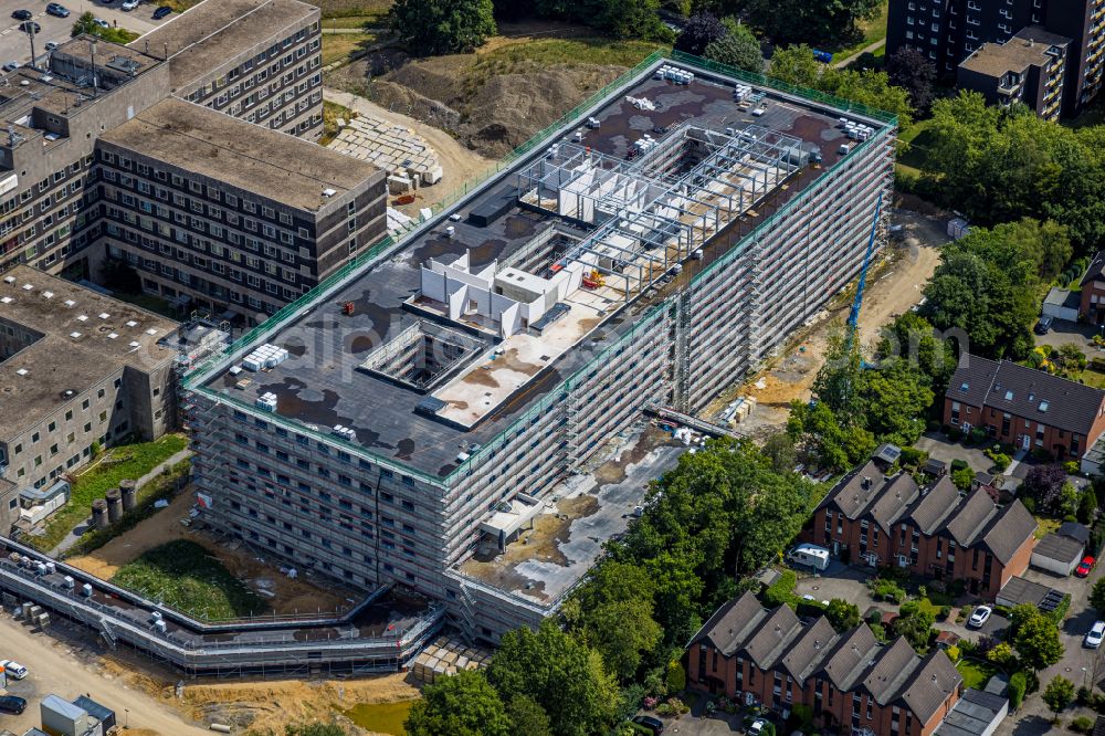 Velbert from the bird's eye view: Construction site for a new extension to the hospital grounds Helios Klinikum Niederberg on Robert-Koch-Strasse in Velbert in the state North Rhine-Westphalia, Germany