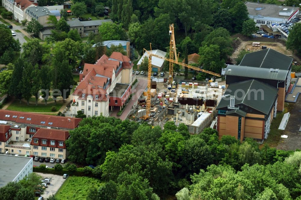 Bernau from the bird's eye view: Construction site for a new extension to the hospital grounds Herzzentrum Brandenburg Ladeburger Strasse in Bernau in the state Brandenburg