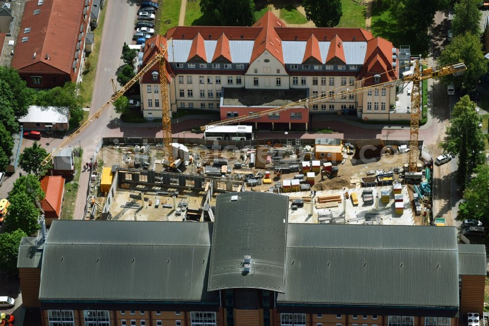 Bernau from the bird's eye view: Construction site for a new extension to the hospital grounds Herzzentrum Brandenburg Ladeburger Strasse in Bernau in the state Brandenburg