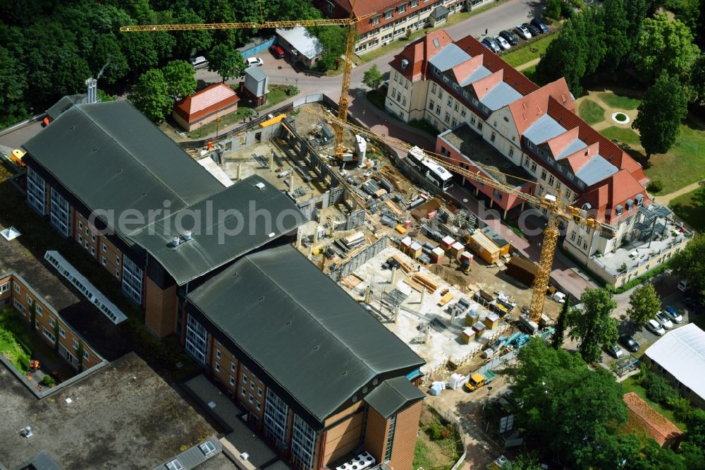 Aerial photograph Bernau - Construction site for a new extension to the hospital grounds Herzzentrum Brandenburg Ladeburger Strasse in Bernau in the state Brandenburg