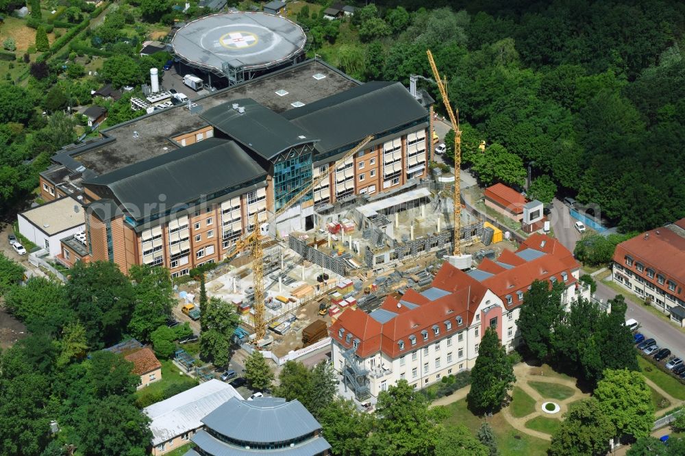 Bernau from the bird's eye view: Construction site for a new extension to the hospital grounds Herzzentrum Brandenburg Ladeburger Strasse in Bernau in the state Brandenburg