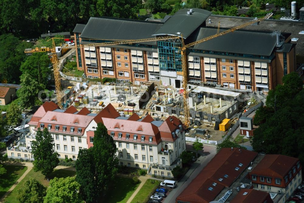 Bernau from the bird's eye view: Construction site for a new extension to the hospital grounds Herzzentrum Brandenburg Ladeburger Strasse in Bernau in the state Brandenburg