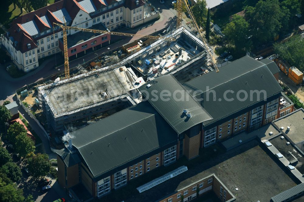 Bernau from the bird's eye view: Construction site for a new extension to the hospital grounds Herzzentrum Brandenburg Ladeburger Strasse in Bernau in the state Brandenburg