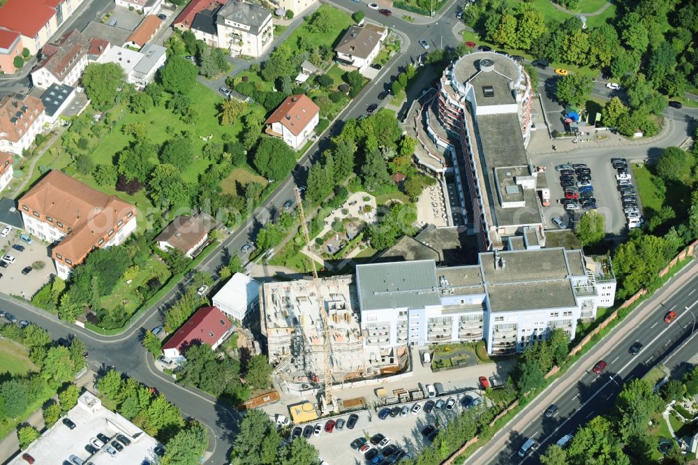 Aerial photograph Bad Kissingen - Construction site for a new extension to the hospital grounds Klinik Bavaria GmbH & Co. KG on Von-der-Tann-Strasse in Bad Kissingen in the state Bavaria, Germany