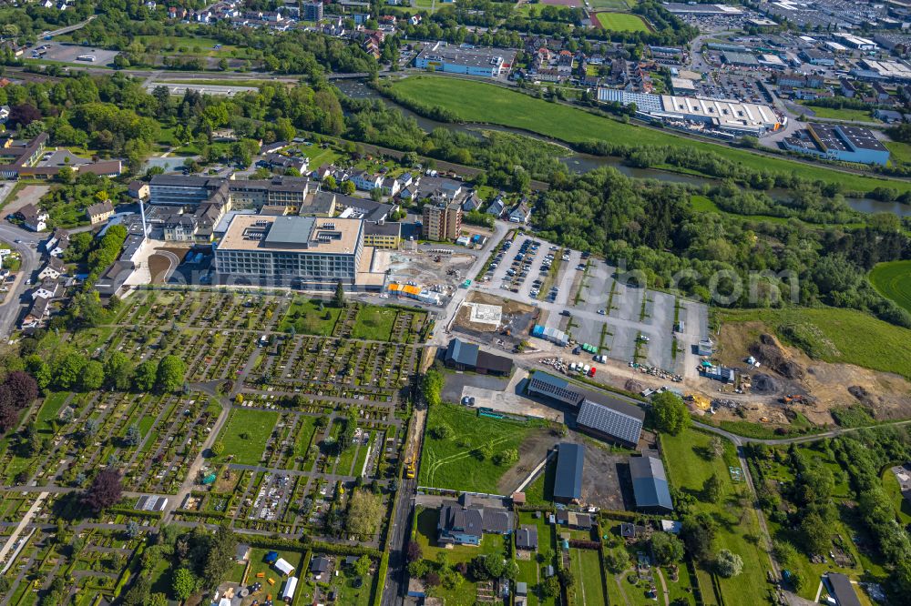 Aerial photograph Arnsberg - Construction site for a new extension to the hospital grounds Klinikum Hochsauerland - Karolinen-Hospital in the district Huesten in Arnsberg at Sauerland in the state North Rhine-Westphalia, Germany