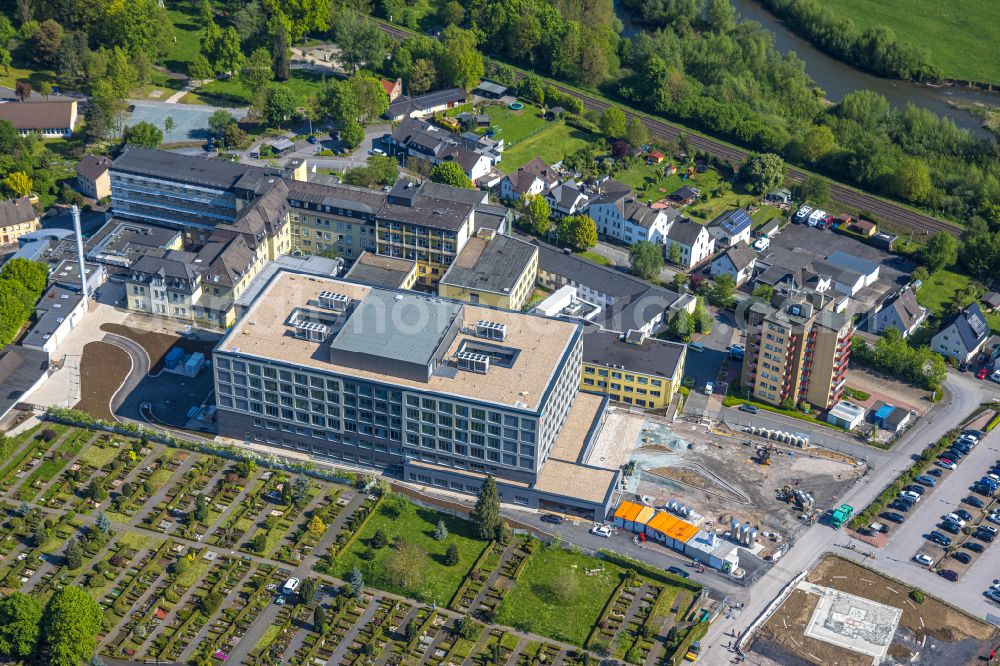 Arnsberg from above - Construction site for a new extension to the hospital grounds Klinikum Hochsauerland - Karolinen-Hospital in the district Huesten in Arnsberg at Sauerland in the state North Rhine-Westphalia, Germany