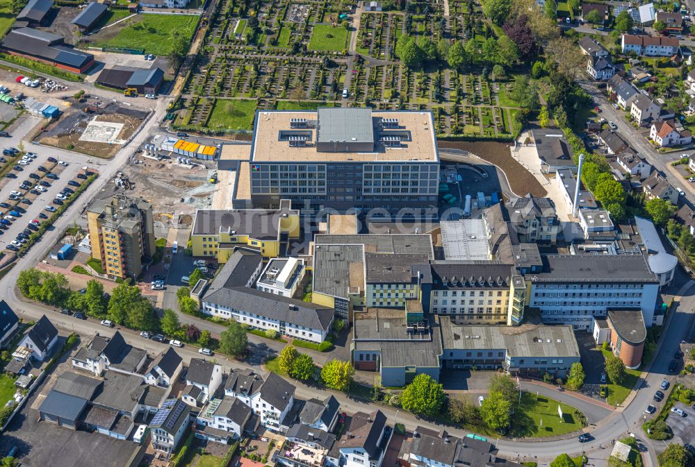 Aerial image Arnsberg - Construction site for a new extension to the hospital grounds Klinikum Hochsauerland - Karolinen-Hospital in the district Huesten in Arnsberg at Sauerland in the state North Rhine-Westphalia, Germany