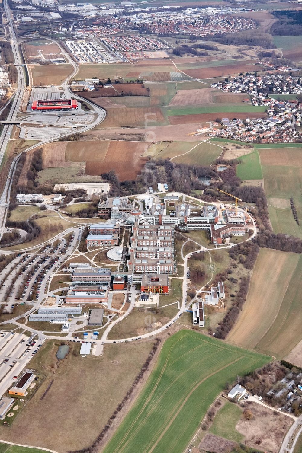 Regensburg from the bird's eye view: Construction site for a new extension to the hospital grounds Universitaetsklinikum Regensburg on Franz-Josef-Strauss-Allee in Regensburg in the state Bavaria, Germany